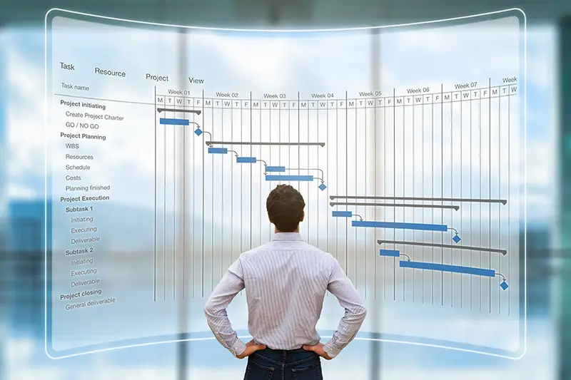 Project manager looking at AR screen with Gantt chart schedule