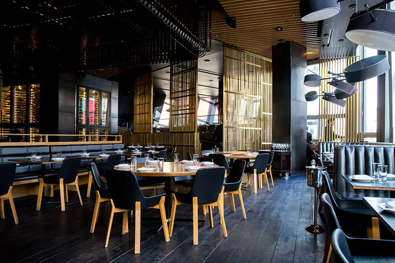 Restaurant interior with black wooden booth