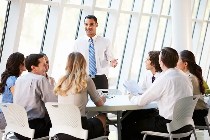 Business People Having Board Meeting In Modern Office