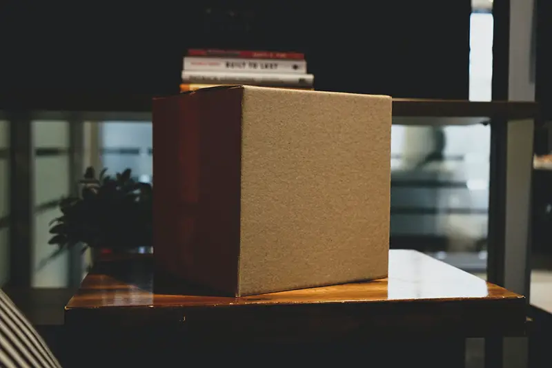 Brown box on wooden surface