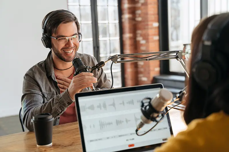 Young man recording a podcast content