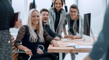 fun group of young employees in the workplace