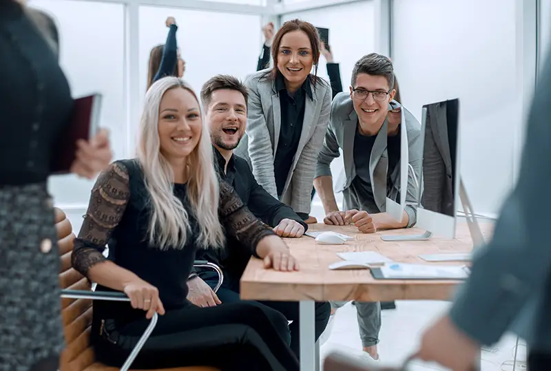 fun group of young employees in the workplace