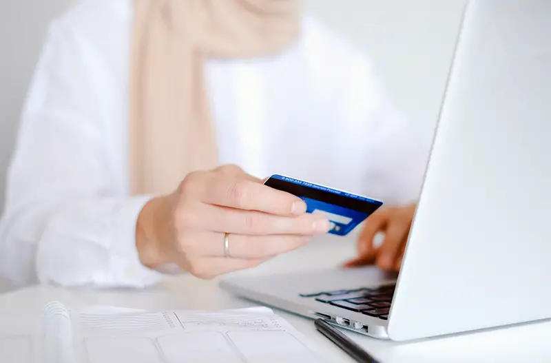 Person using card for payment online