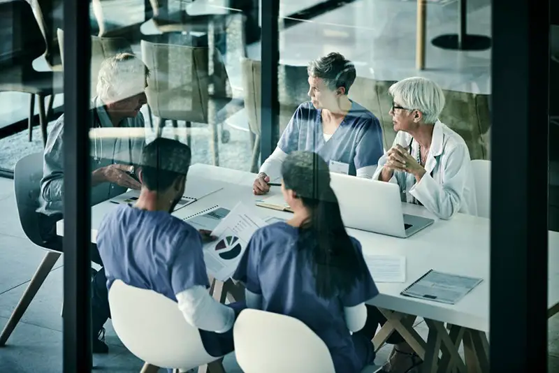 Group of people working in a medical field having a meeting