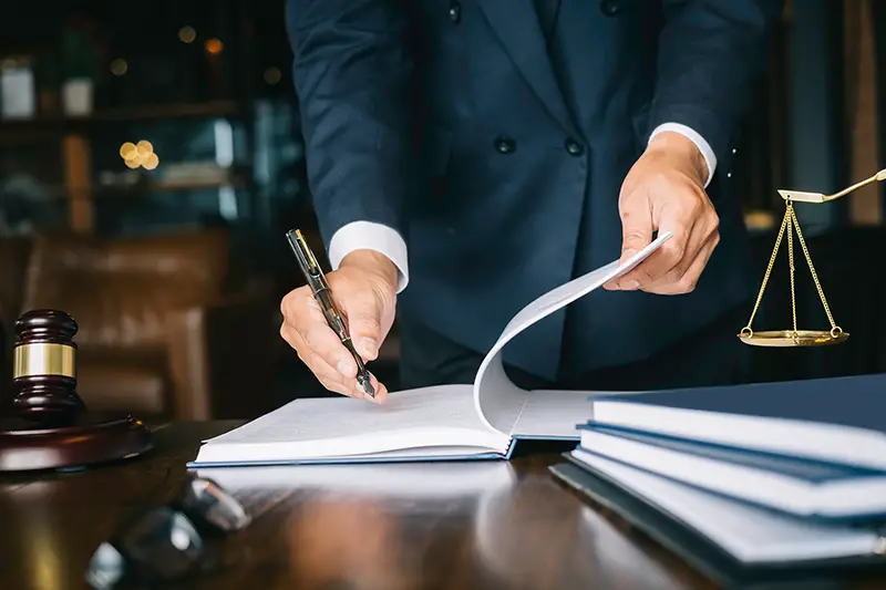 Lawyer signing in a document