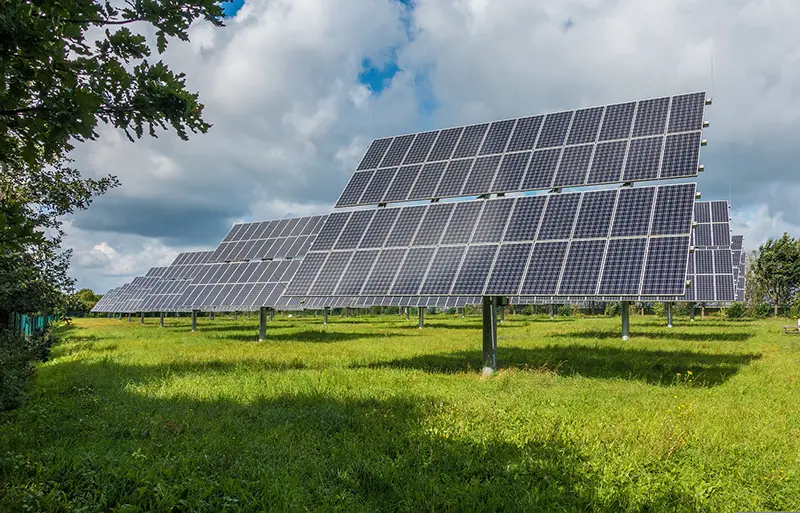 Solar panel in the middle of green field