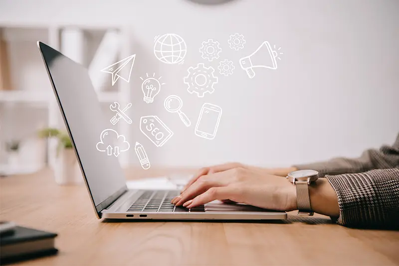 Businesswoman typing on her laptop