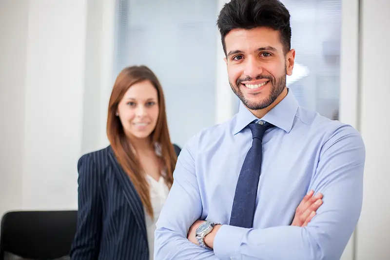 Couple of smiling business people