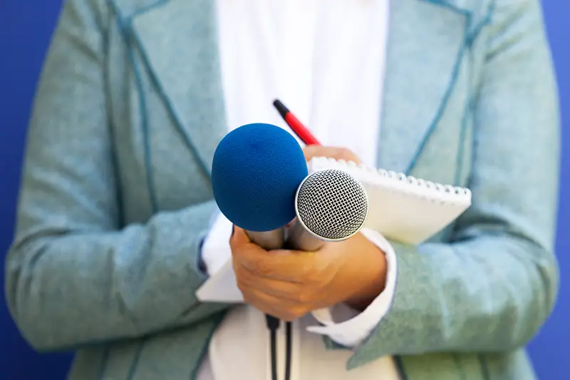 Female reporter at press conference