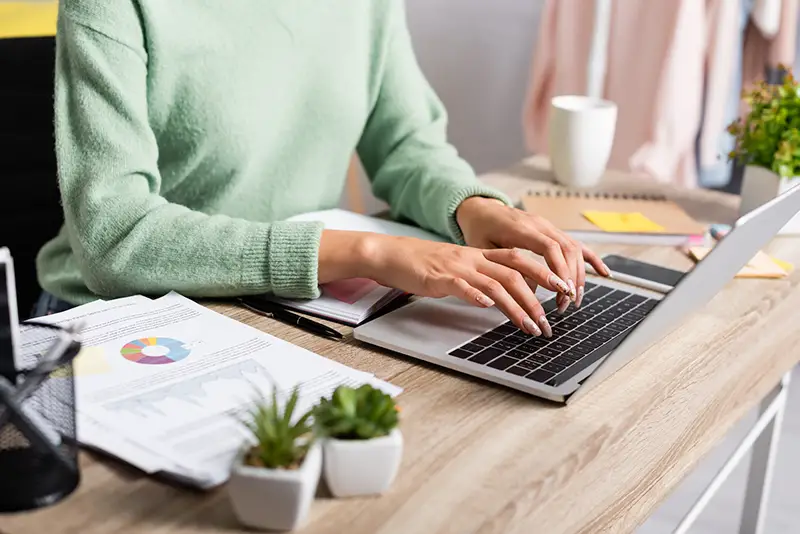 Woman entrepreneur working on her laptop