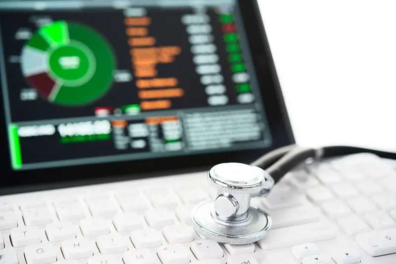 digital tablet and stethoscope on keyboard