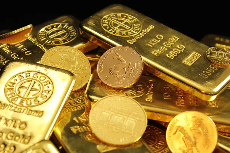 Gold bar and gold coins