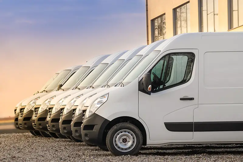 commercial delivery vans parked in row