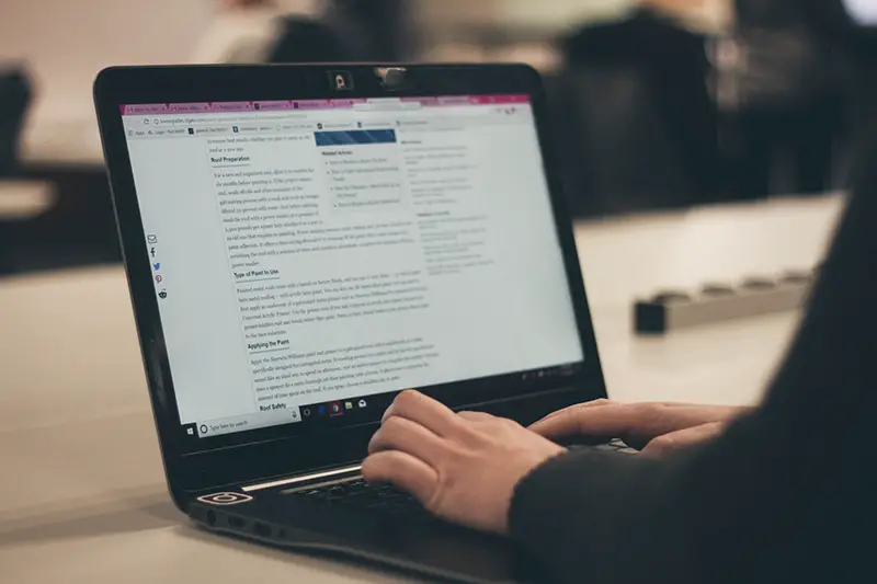 Person typing on laptop computer