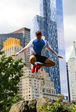 Young male millenial captured image with buildings on his background