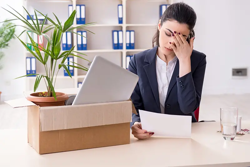 Young female employee being fired from her work