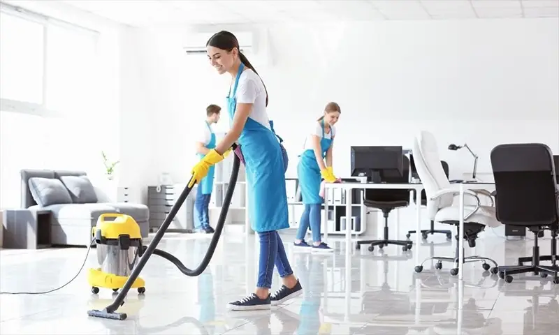 Worker cleaning the office