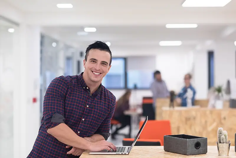 Young businessman at modern startup office