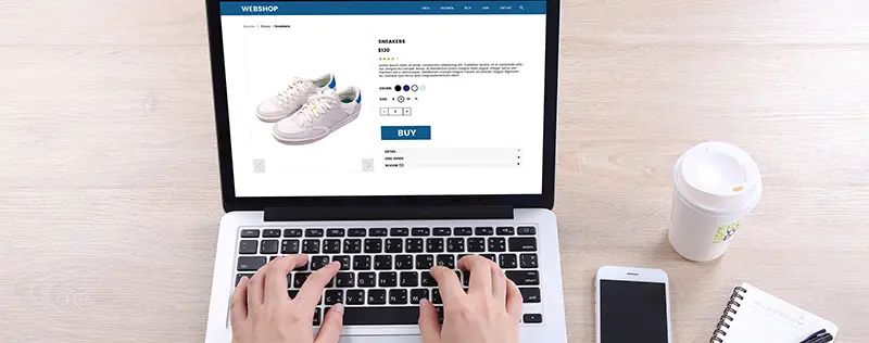 Top view business woman buying sneakers on ecommerce website 
