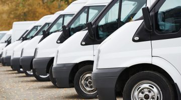 commercial delivery vans in row at parking place