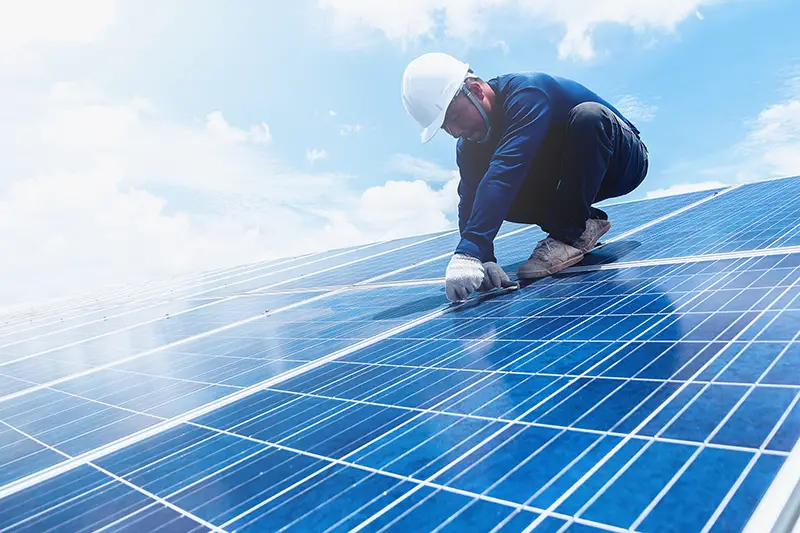 engineer team working on replacement solar panel in solar power plant;