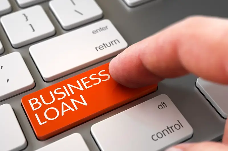 Business loan text on keyboard