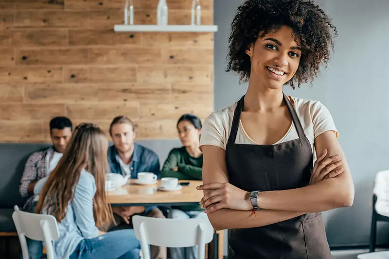 Smiling african american waitress