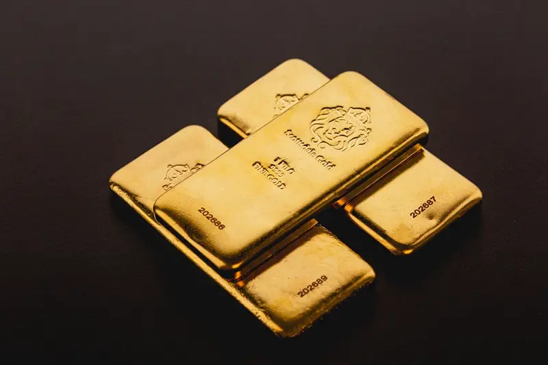 Gold bars with dark background
