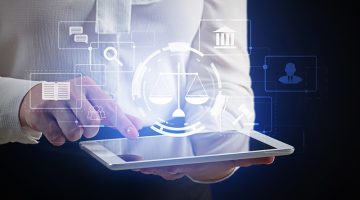Female lawyer with tablet computer using virtual screen