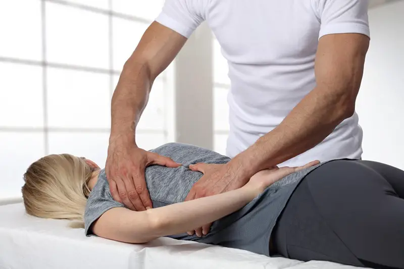 Chiropractor With His Patient