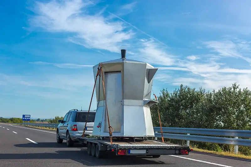 Car trailer with unusual kiosk in the form of Espresso