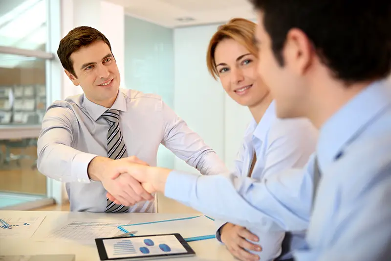 Businessman shaking hand to business partner