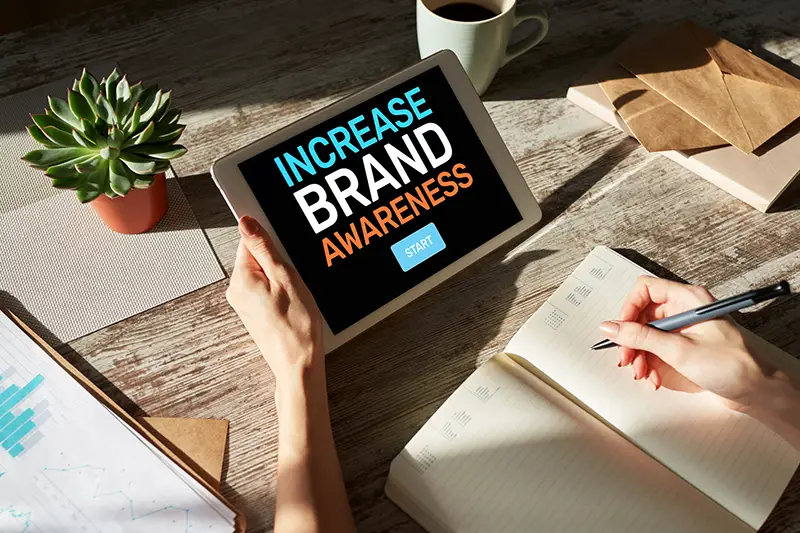 Increase brand awareness text on screen.