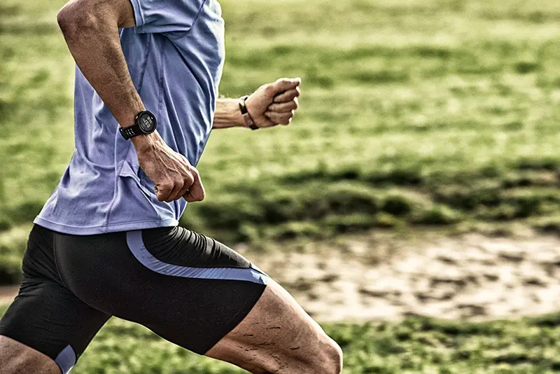 Man wearing garmin sport watch while running