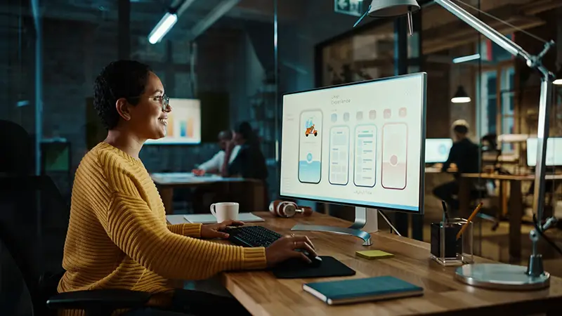 Woman working in front of her desktop