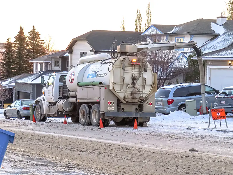 Hydro excavation trucks or hydrovac using water to break up the ground and vacuuming to remove the soil onsite during the winter.