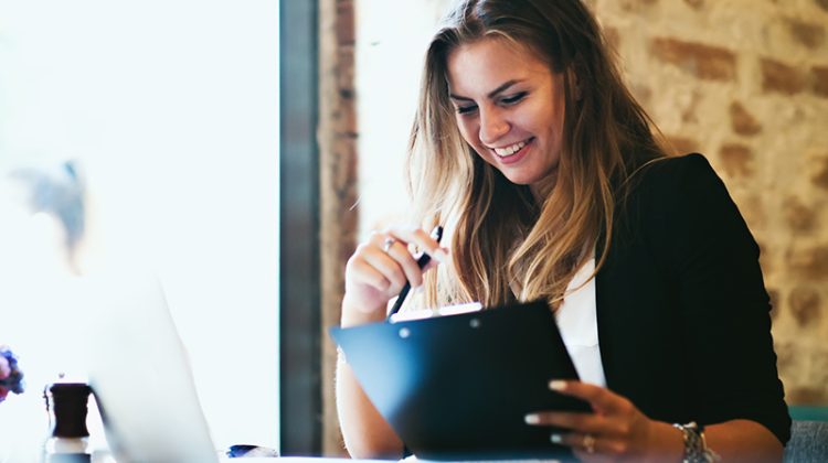 Business woman with a folder at the table