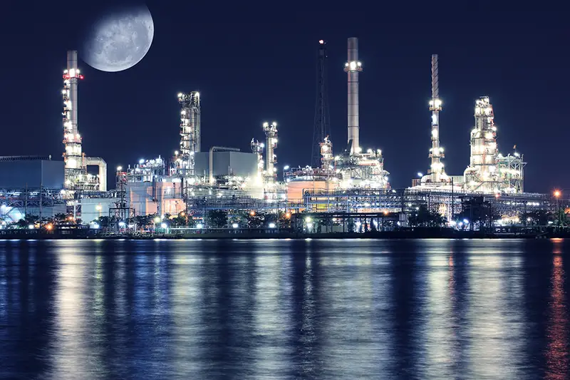 Big moon over oil refinery plant night scene nearby river in Thailand