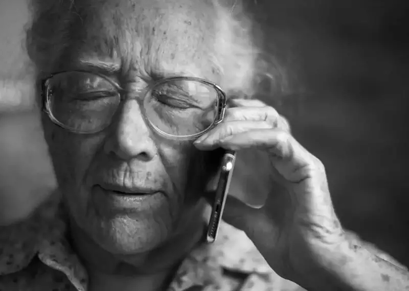Senior old woman using mobile phone