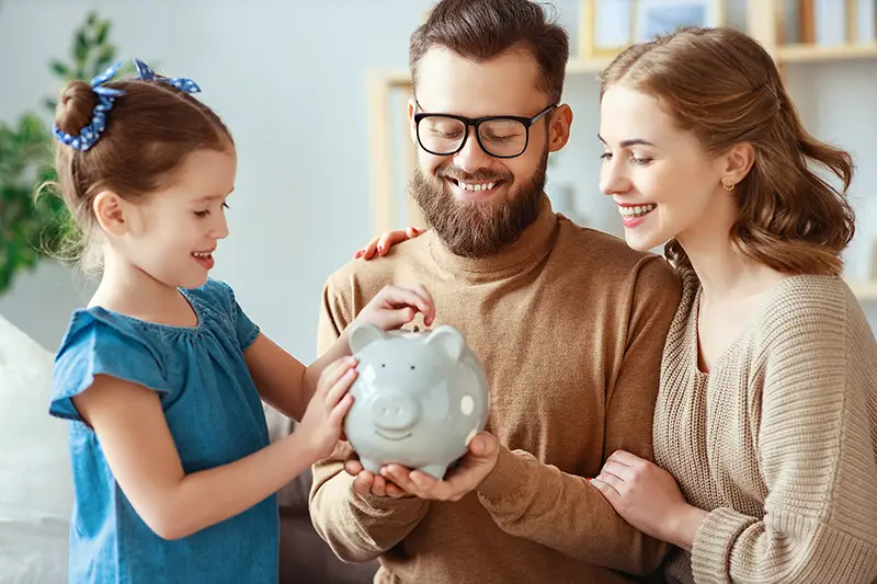 family savings, budget planning, children's pocket money. family with piggy Bank moneybox