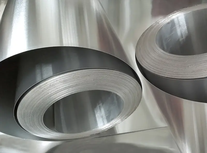 Two aluminum metal coils in industrial room