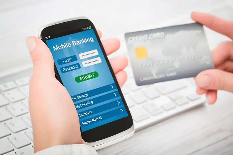 Woman holding smart phone with mobile banking application on a screen.