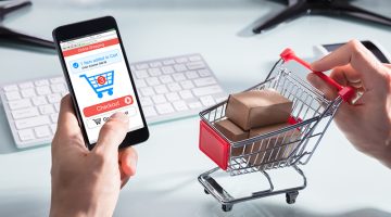 Person Shopping Online On Mobile Phone