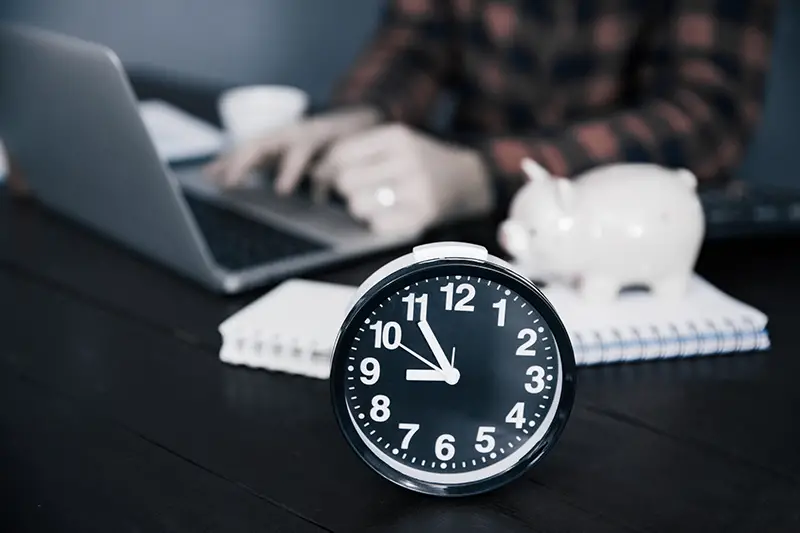 business man working with clock on desk