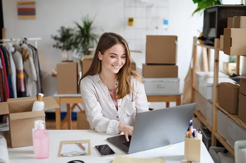 Young woman dropshipper with laptop