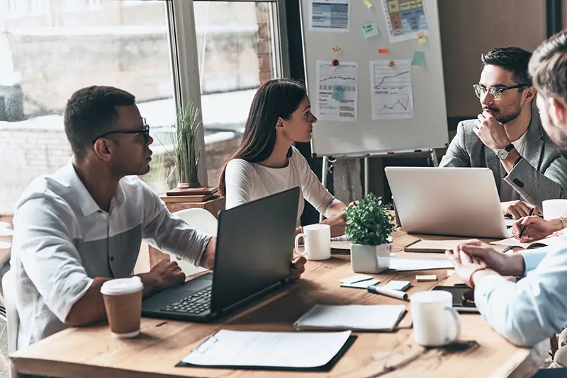 Local marketing agency team discussing business while sitting in the creative office