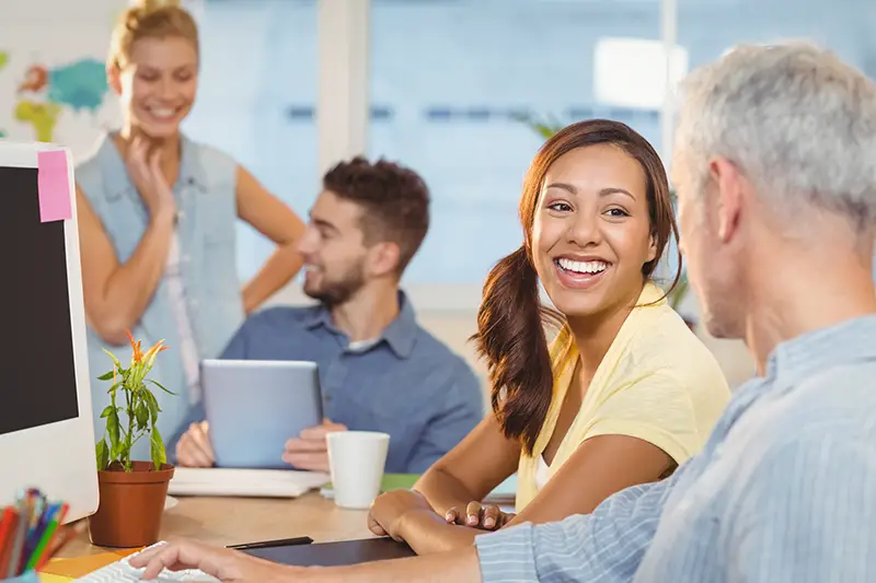 employees working in background at creative office