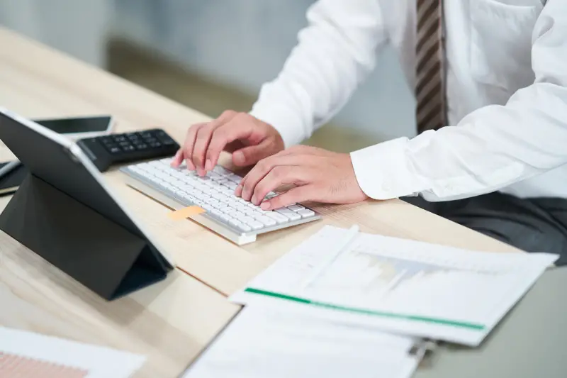 Hands of businessman doing accounting work