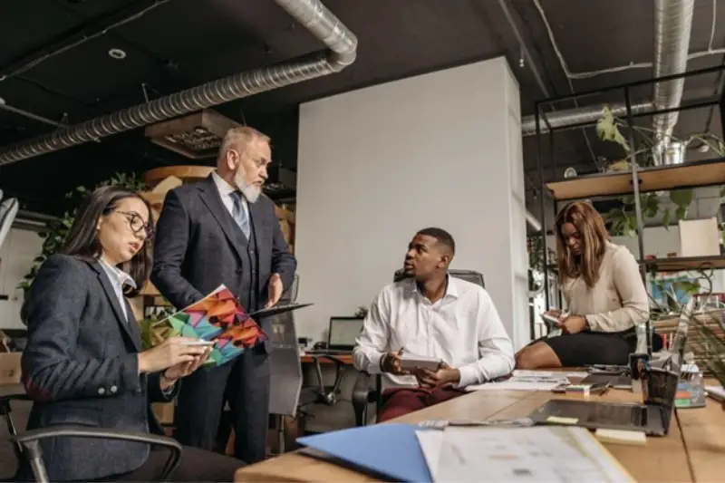 Businessman having a meeting with his staff